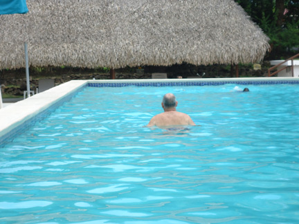 John enjoys the pool. Better get some sunscreen on that head, don'tcha think?